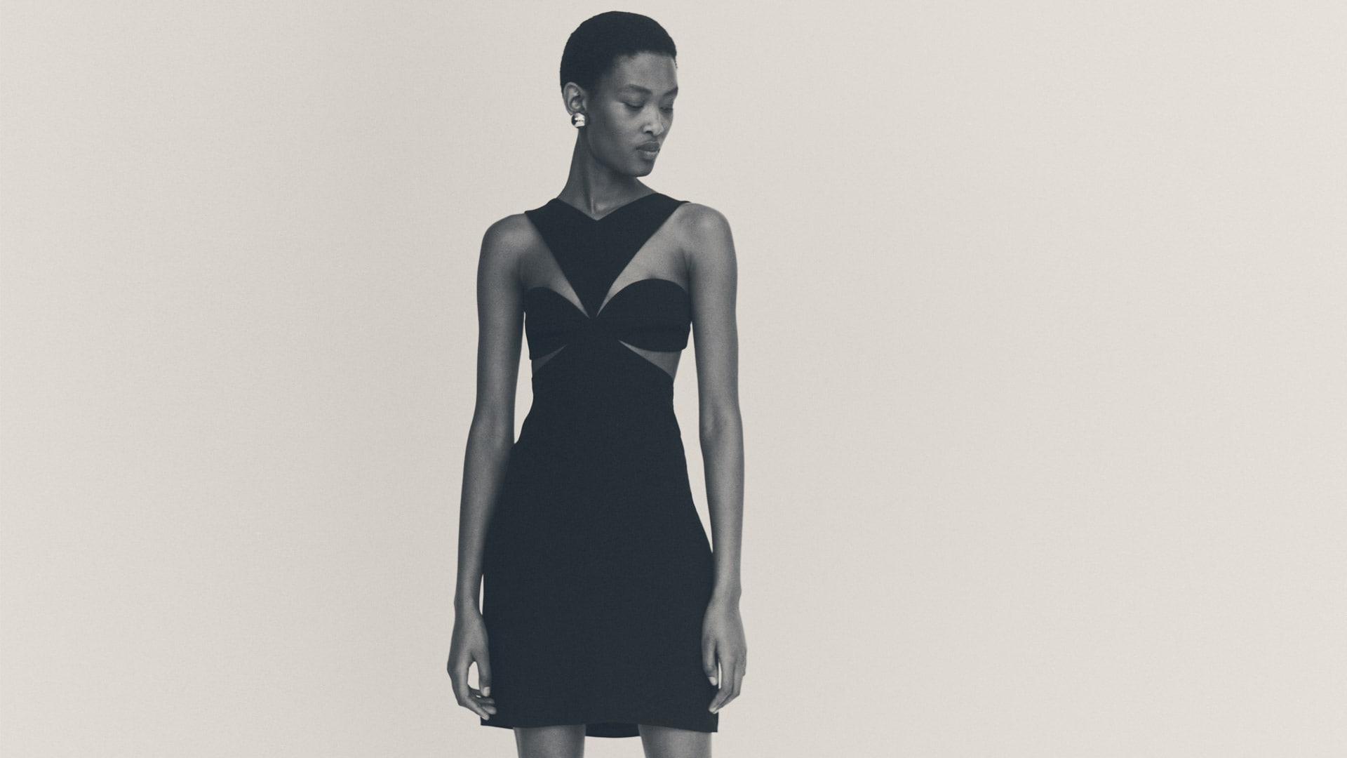 Cut out dress in crepe satin with rhinestones detail