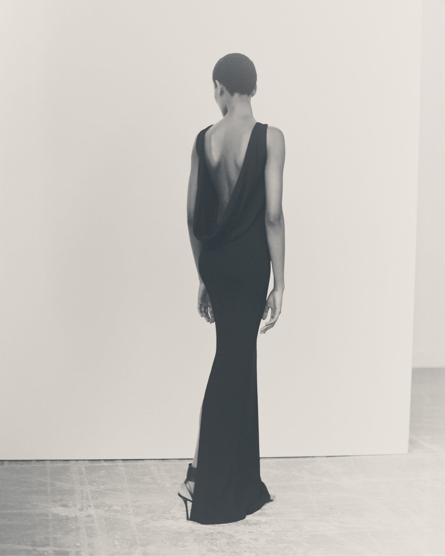 Evening dress in textured jersey with crystal laces